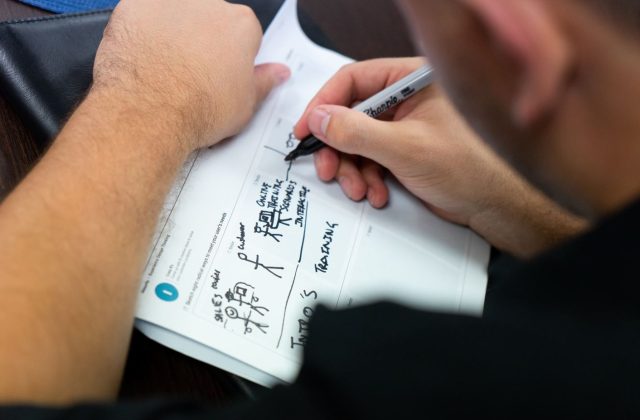 Why do we emphasise sketching while brainstorming solutions?