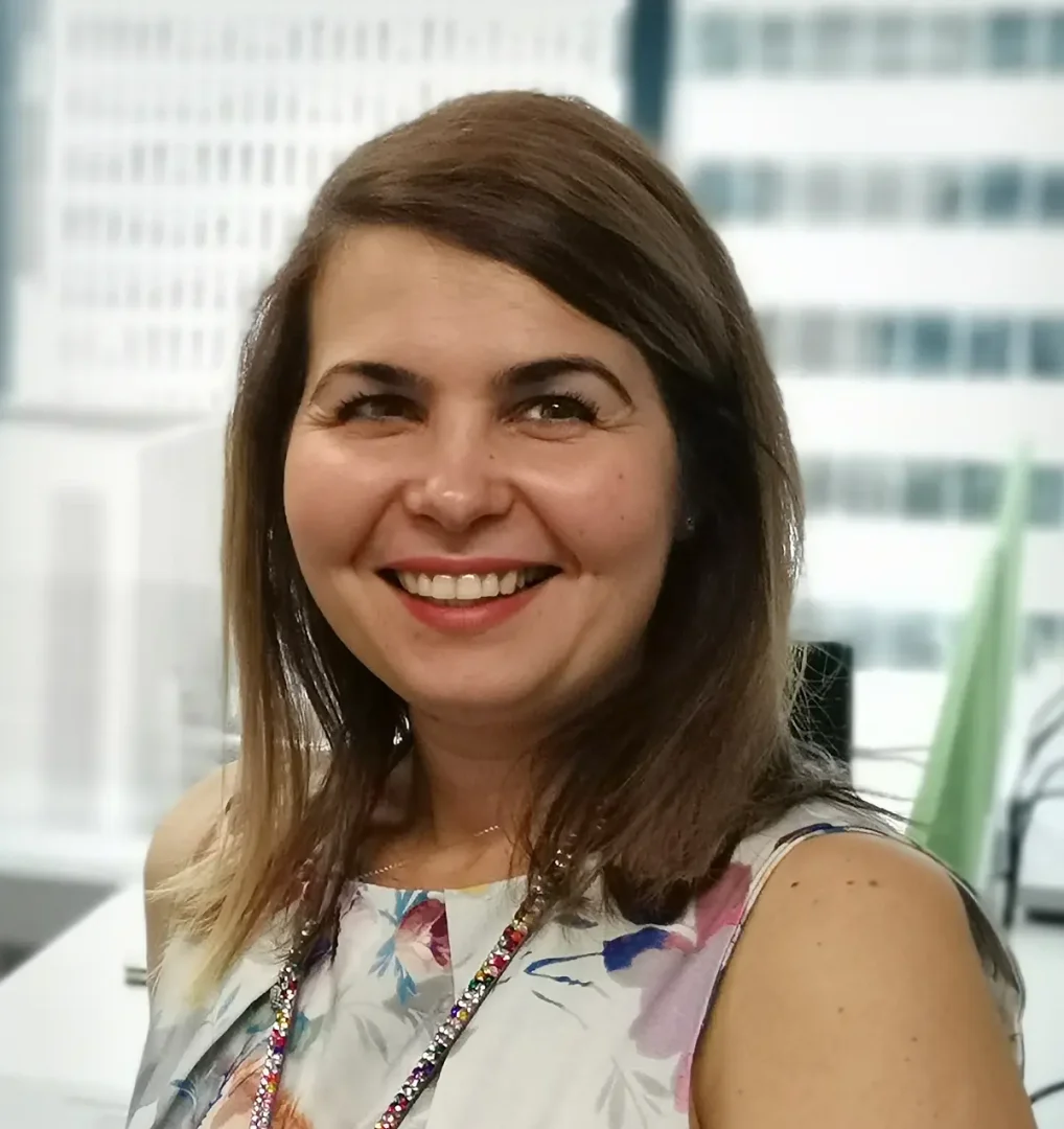 Sinziana Ciubotaru, Senior Project Manager at NZQA’s Information Services, is shown in a professional portrait. Her face is intentionally blurred, and the neutral background keeps the focus on her role and title, suggesting use for internal or formal corporate materials.